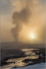 Old faithful backlit by the rising sun